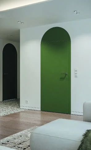 Ușă filomuro Porta Hide vopsită verde, în același ton cu peretele arcuit din jur